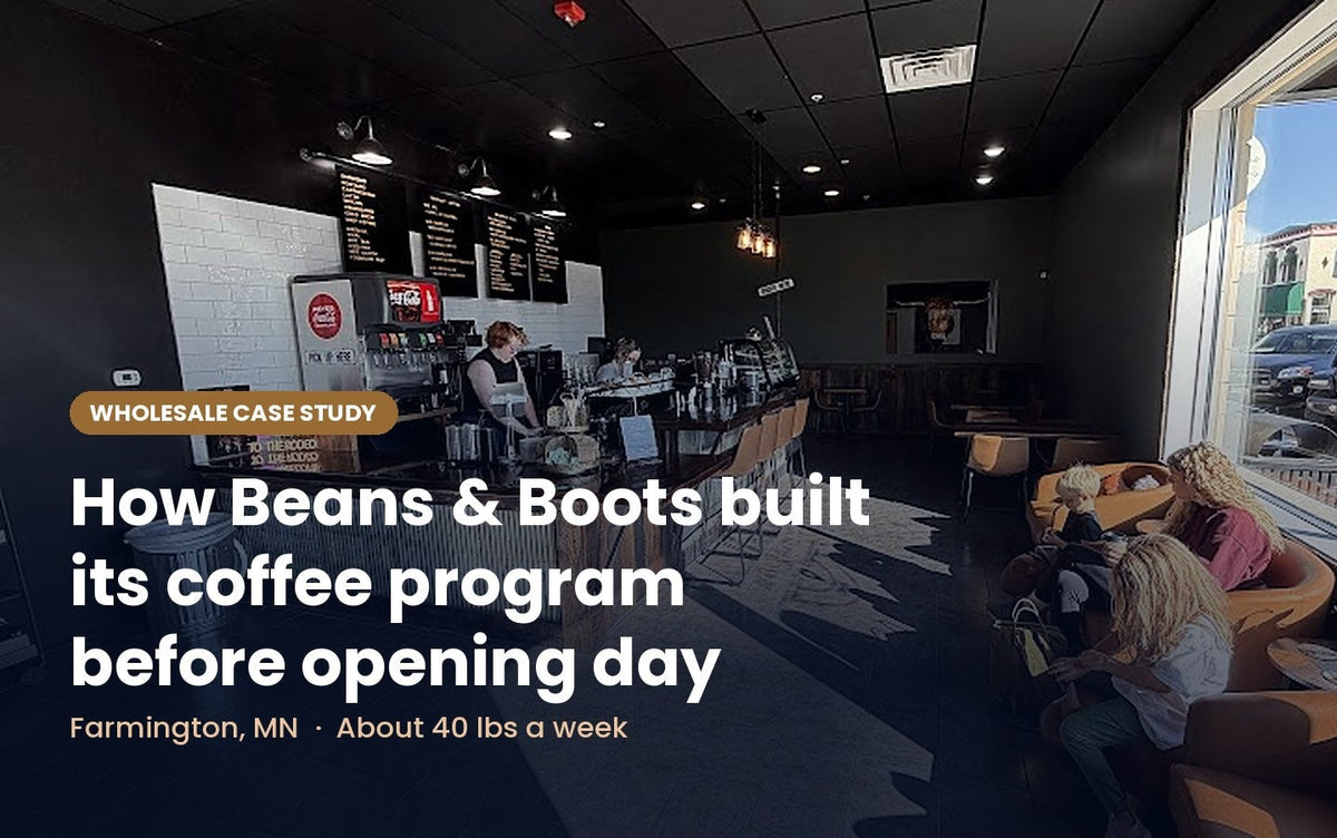 Inside Beans & Boots coffee shop in Farmington, MN, with baristas at the counter and customers relaxing in leather chairs by the front windows.