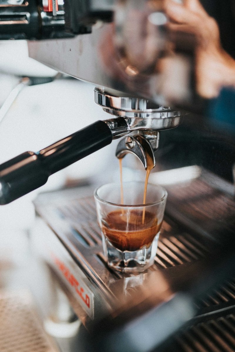 Espresso shot pouring from a portafilter